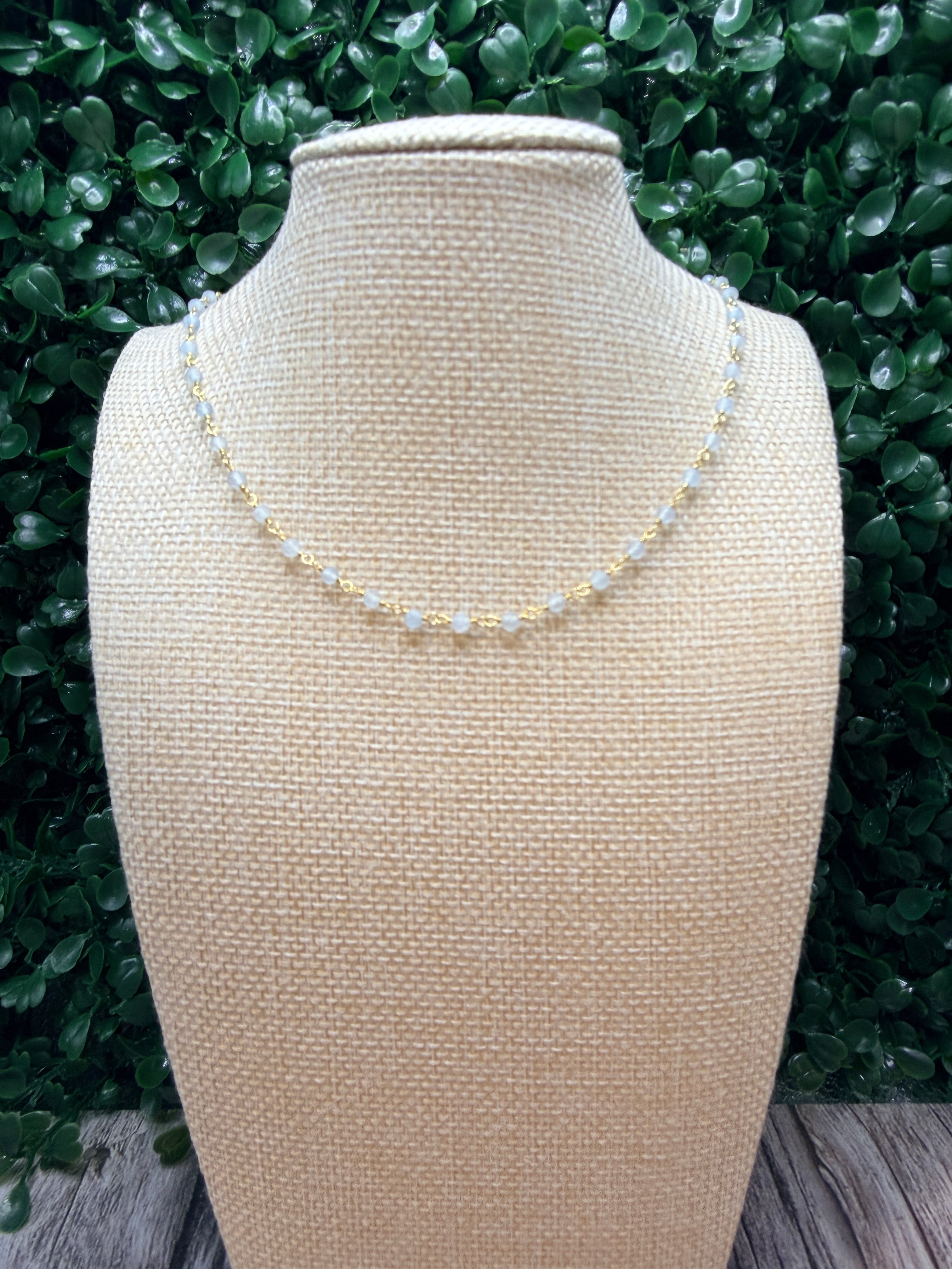 Aquamarine faceted rondelles on a vermeil hand wrapped chain.
