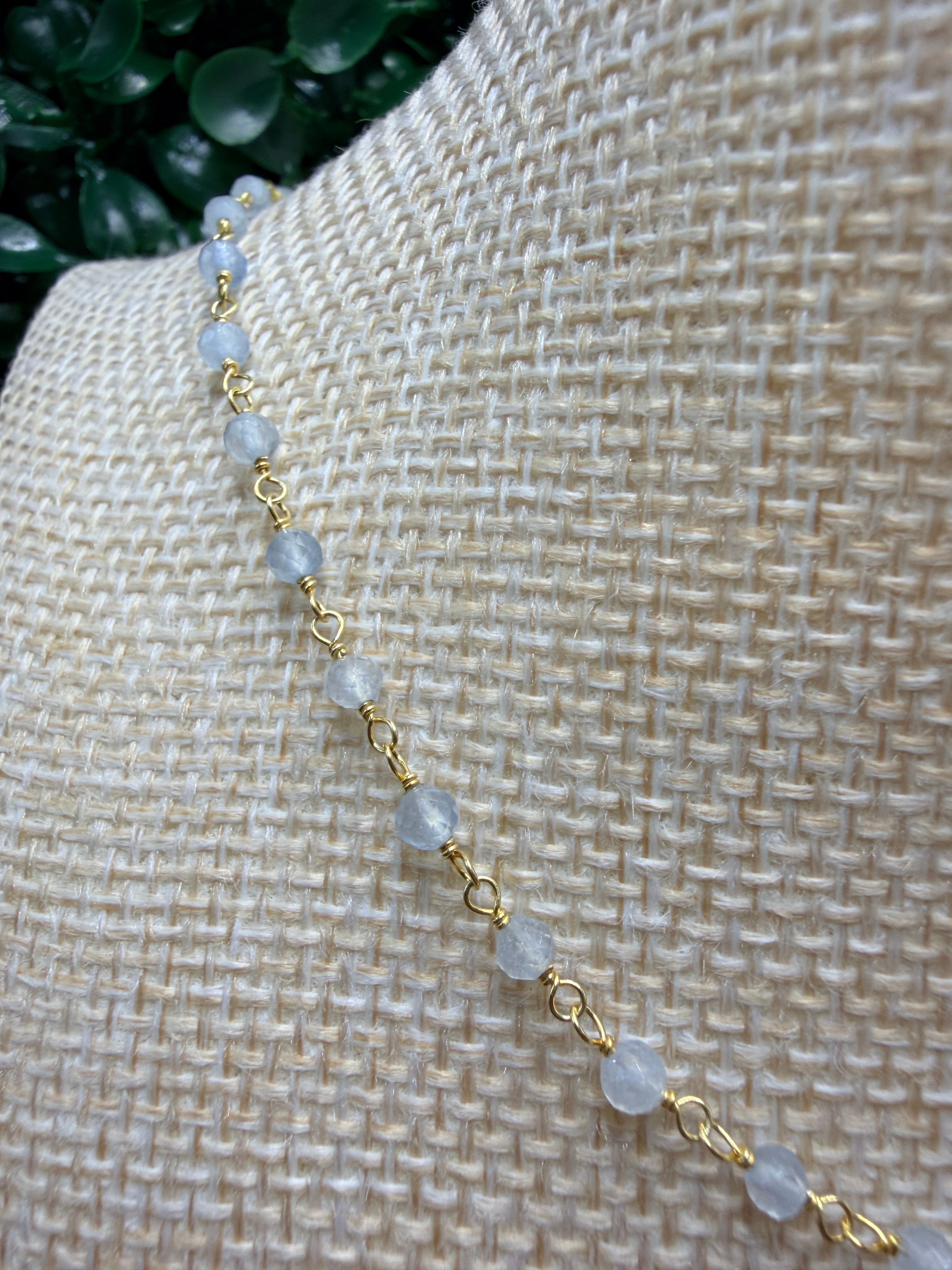 Aquamarine faceted rondelles on a vermeil hand wrapped chain.