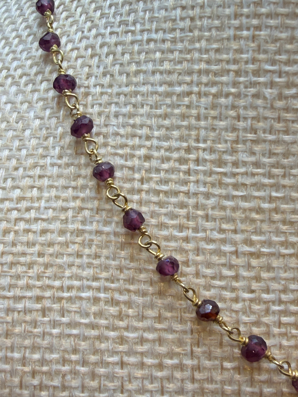 Garnet faceted rondelles on a vermeil hand wrapped chain.