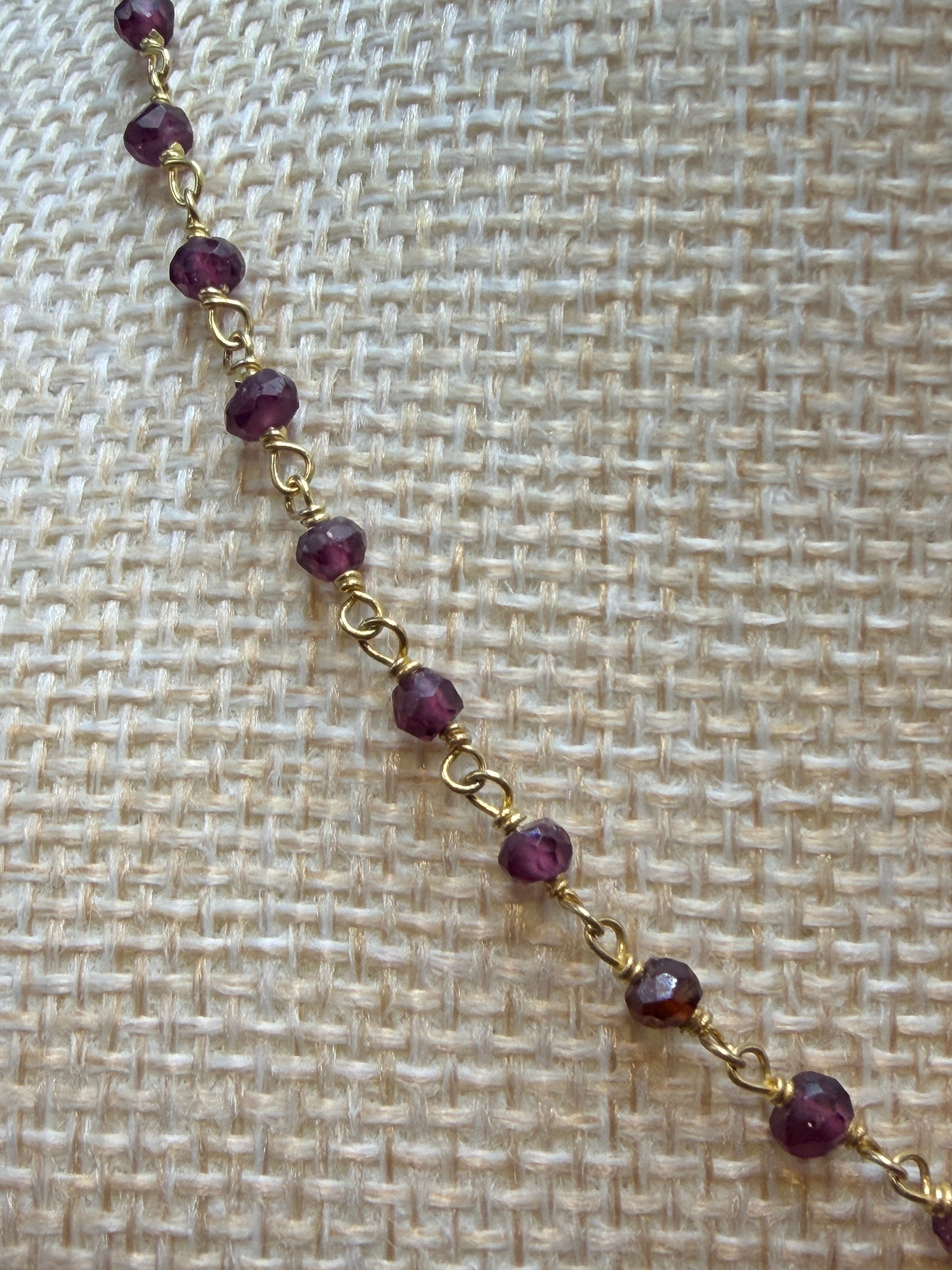 Garnet faceted rondelles on a vermeil hand wrapped chain.
