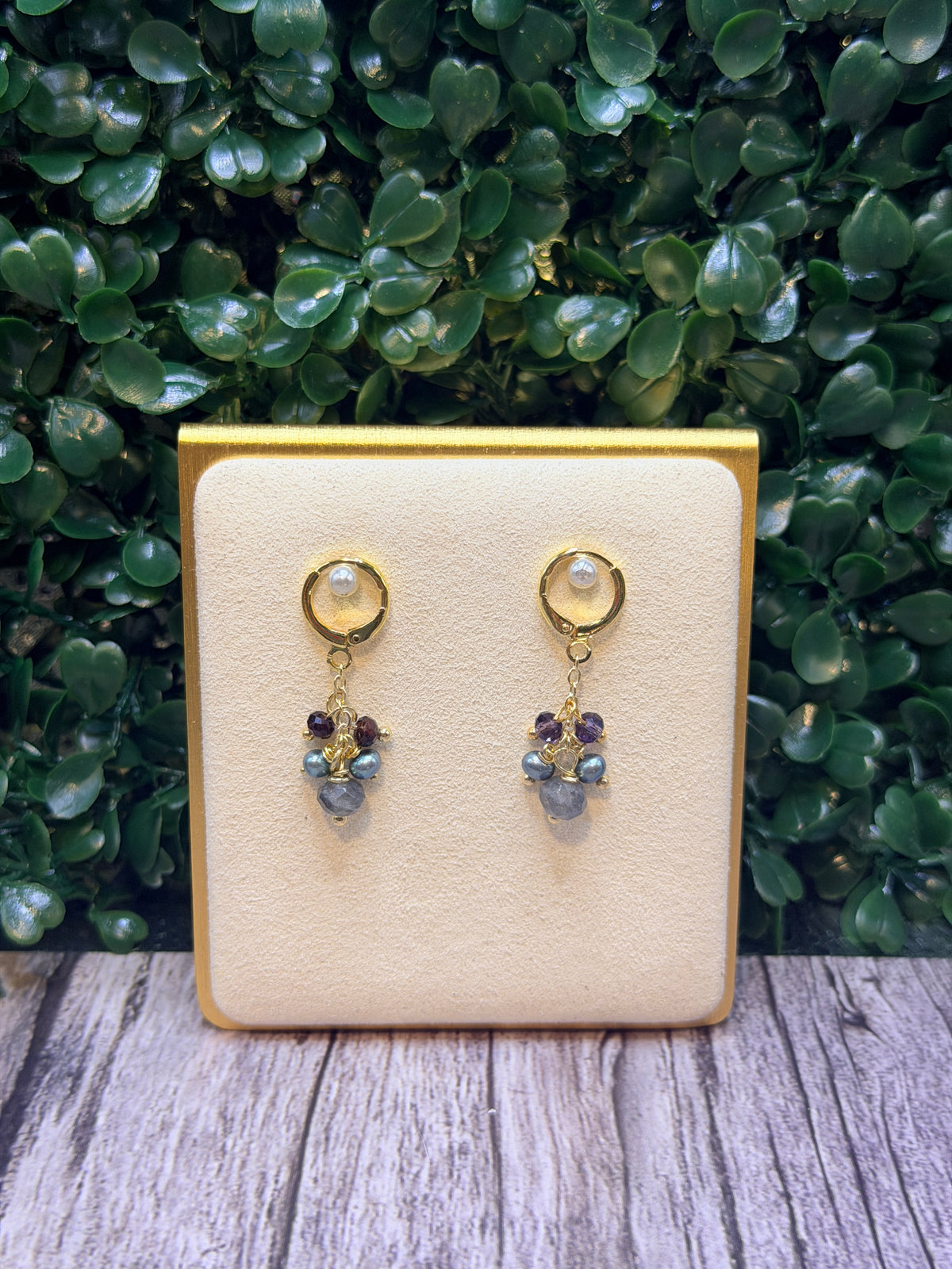Iolite drop earring with a cluster of grey freshwater pearls and amethyst gemstones