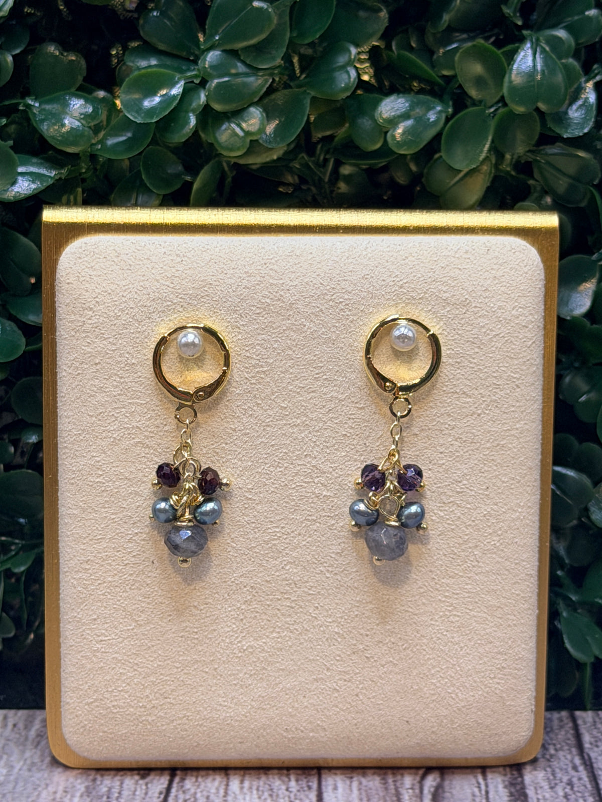 Iolite drop earring with a cluster of grey freshwater pearls and amethyst gemstones