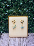Peacock green freshwater pearls with a cluster of multicolored fluorite gemstones