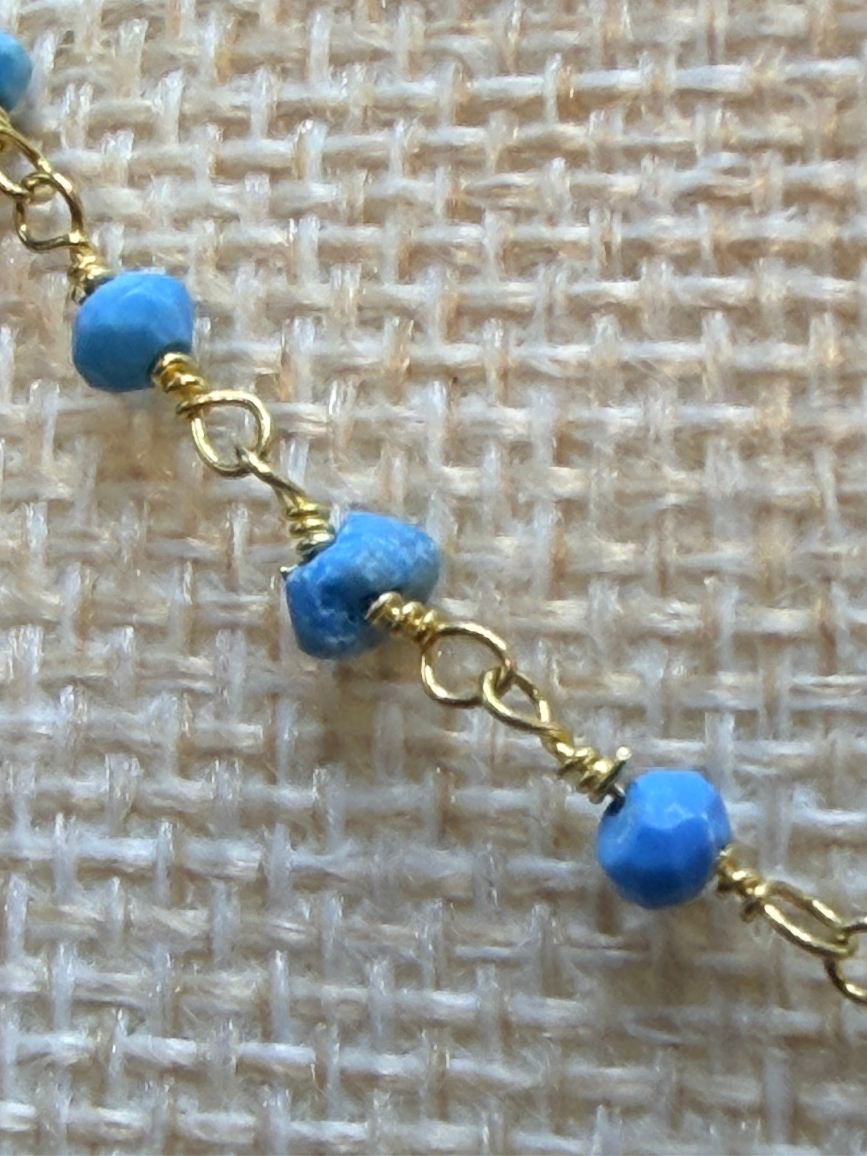 Turquiose faceted rondelles on a vermeil hand wrapped chain.