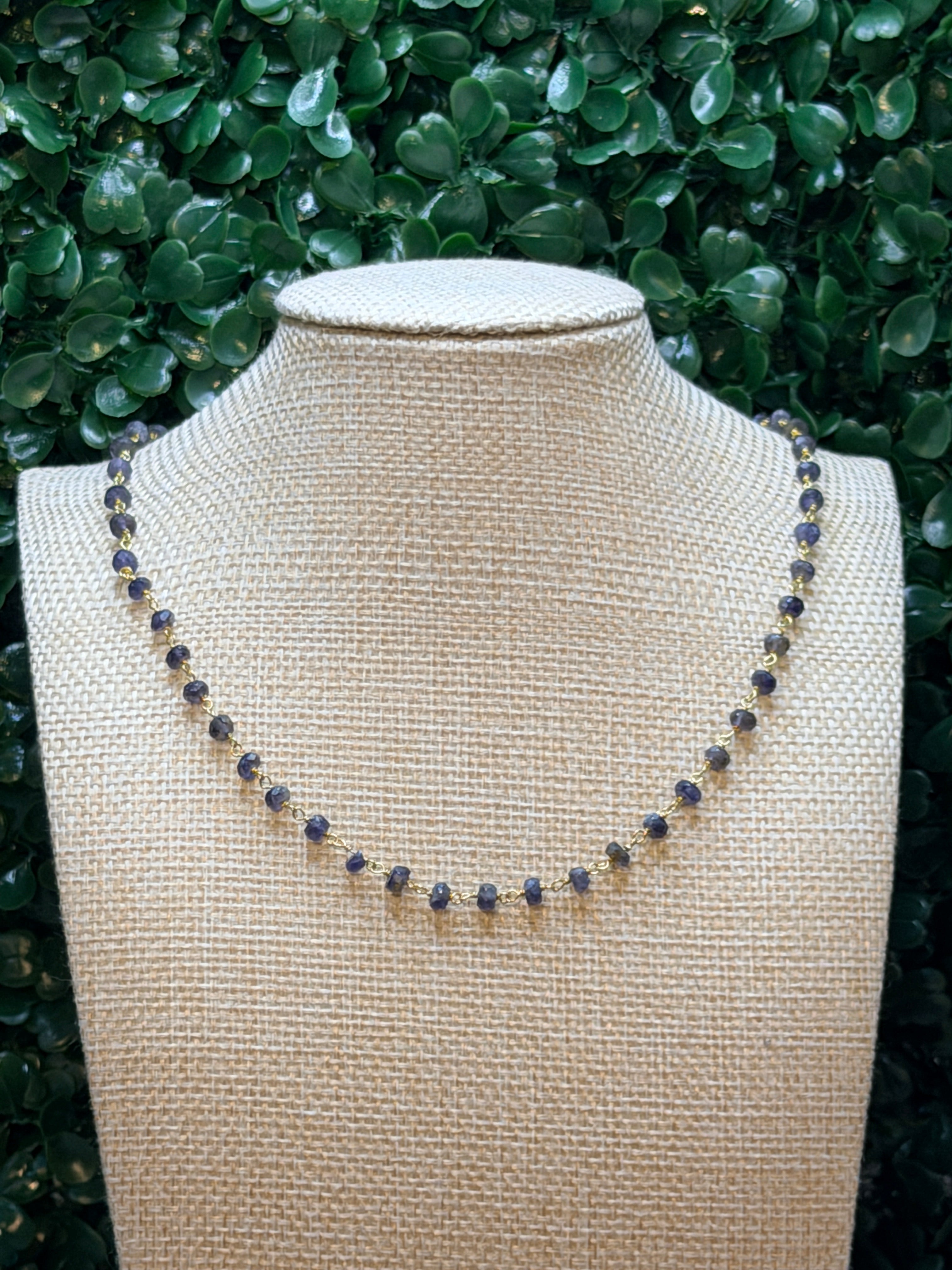 Iolite faceted rondelles on a vermeil hand wrapped chain.