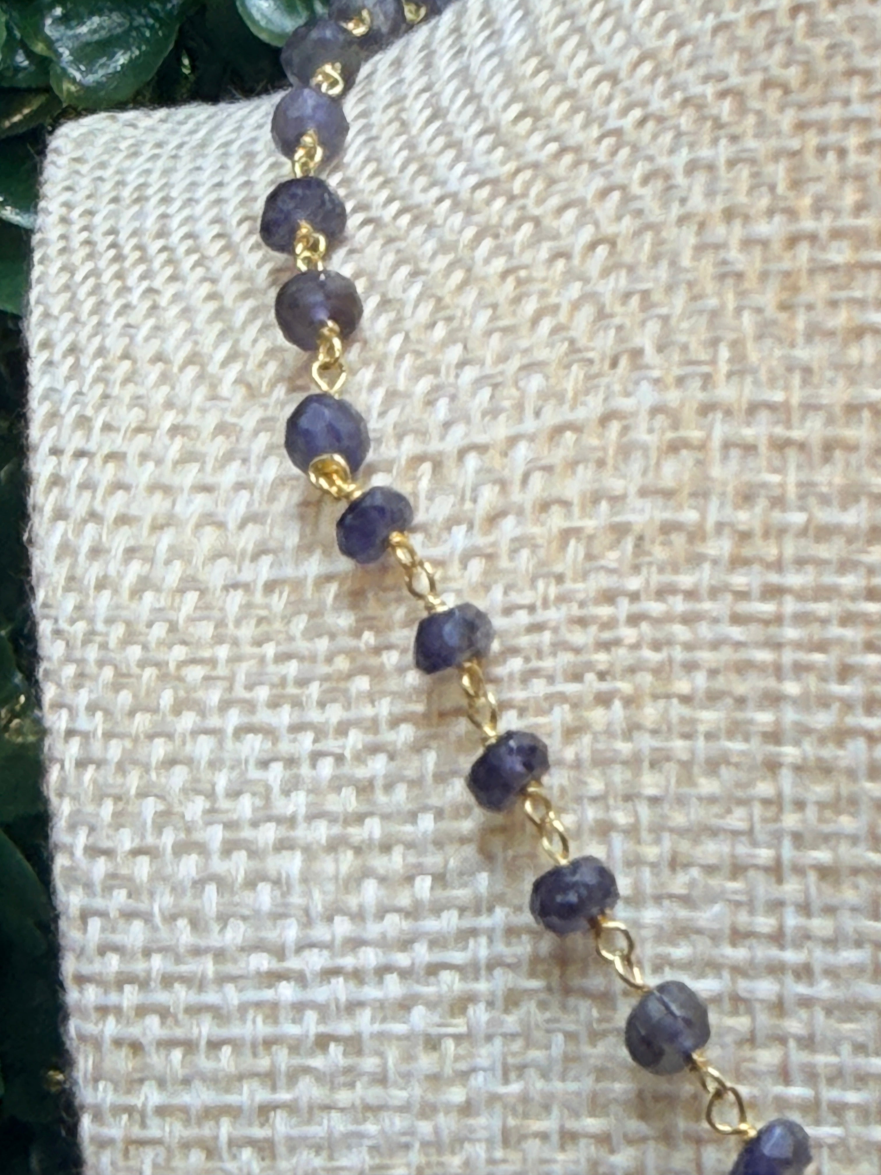 Iolite faceted rondelles on a vermeil hand wrapped chain.