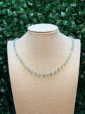 Blue chalcedony faceted rondelles on a vermeil hand wrapped chain.