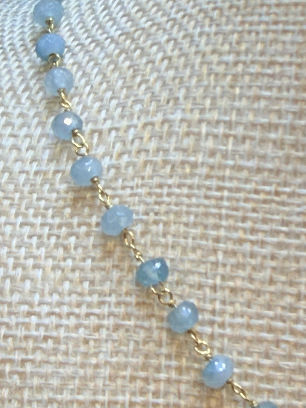 Blue chalcedony faceted rondelles on a vermeil hand wrapped chain.