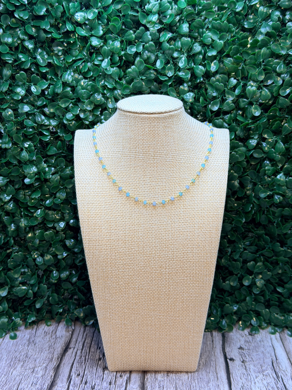 Aqua and blue chalcedony faceted rondelles on a vermeil hand wrapped chain.