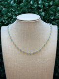 Aqua and blue chalcedony faceted rondelles on a vermeil hand wrapped chain.