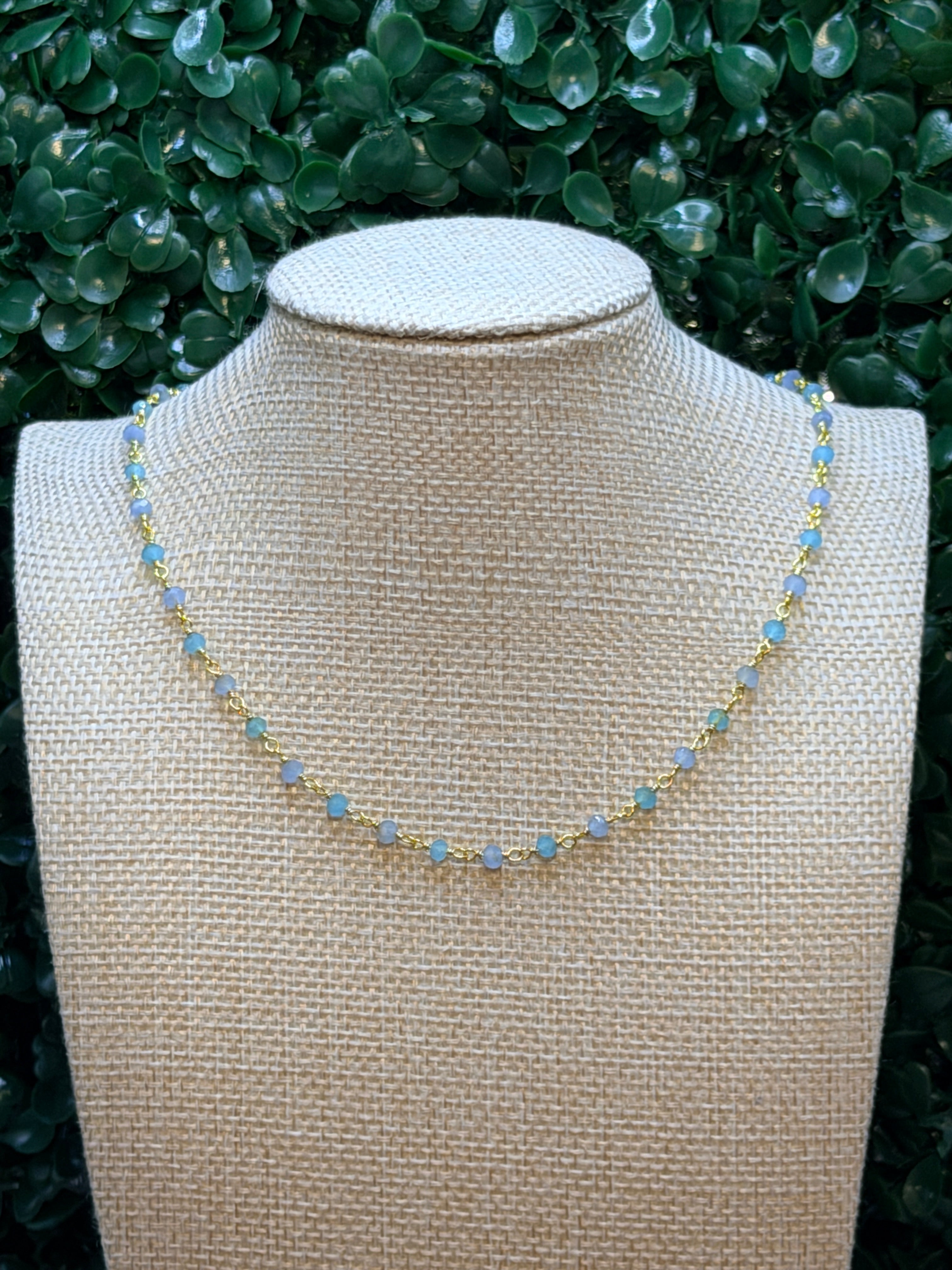 Aqua and blue chalcedony faceted rondelles on a vermeil hand wrapped chain.