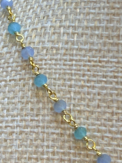 Aqua and blue chalcedony faceted rondelles on a vermeil hand wrapped chain.