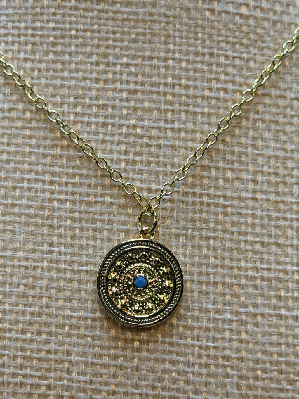 Gold and turquoise disc pendant necklace