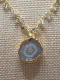 Rutilated cluster rosary necklace with solar quartz geode slice pendant