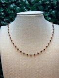Garnet faceted rondelles on a vermeil hand wrapped chain.